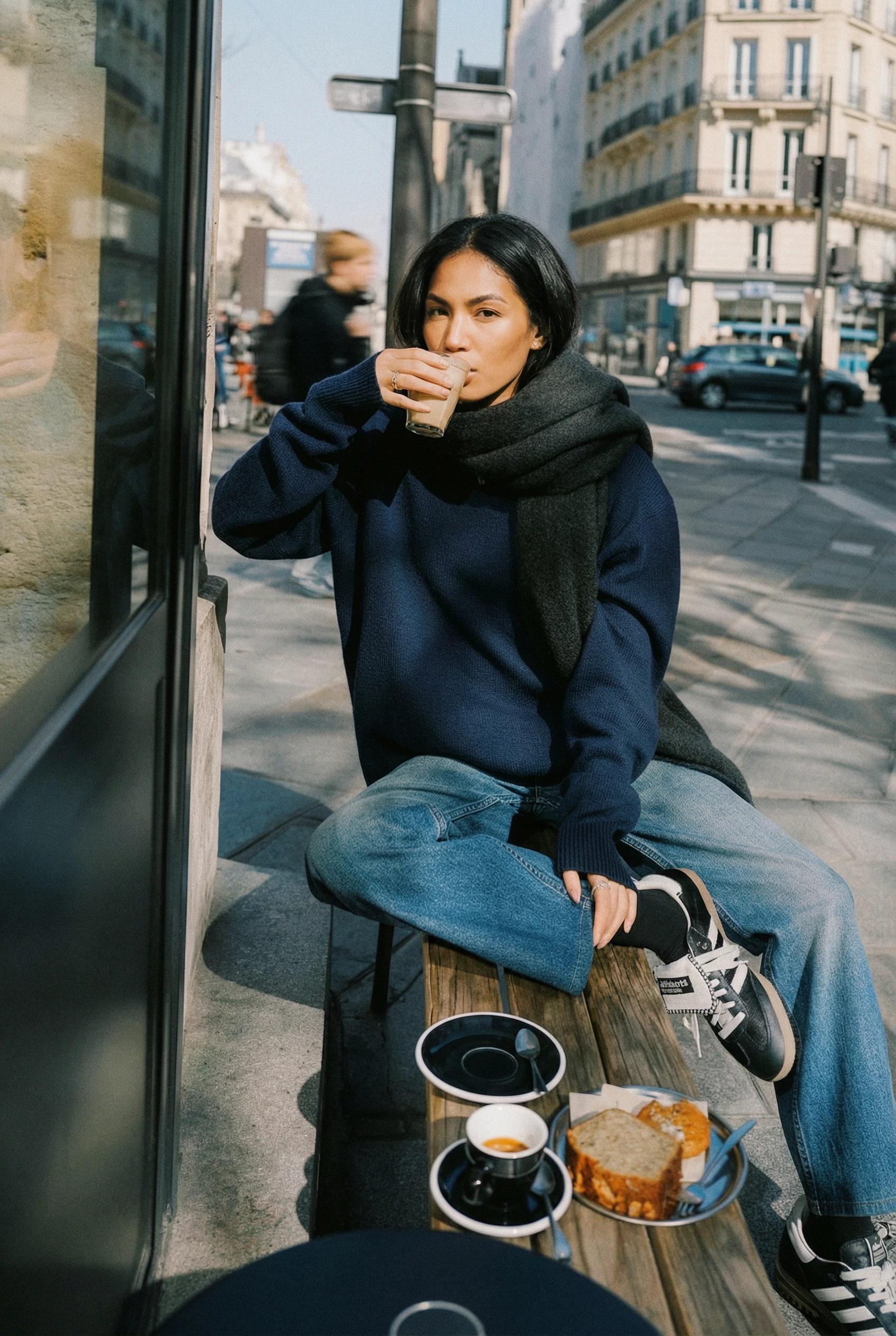 Create a photo of the woman in image 1, but in the camera composition and film photo filter style from image 2, with the woman sitting on the bench from image 2 in winter clothing, in a phone camera style with soft grains, 90s photo style, shot in the same angle and fov as image 2, warm tone on the bright surface, and cool tone in the shadows with accurate white balance.